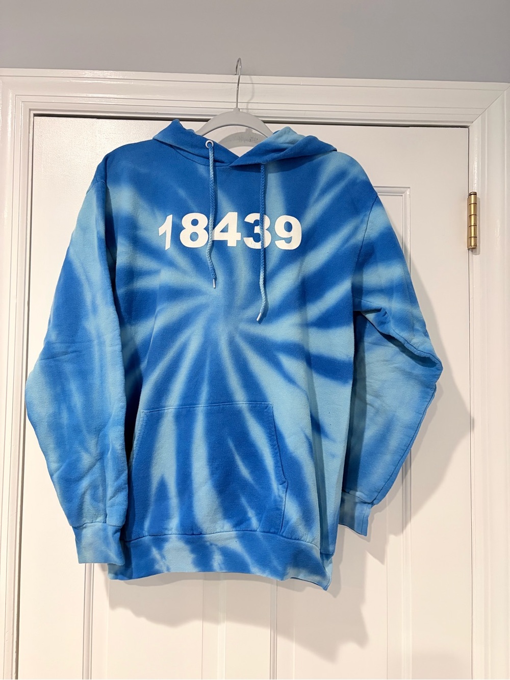 Blue Tie-Dye Hoodie with White Zip Code '18439' Print